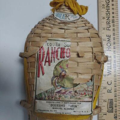 Vintage tequila bottle woven