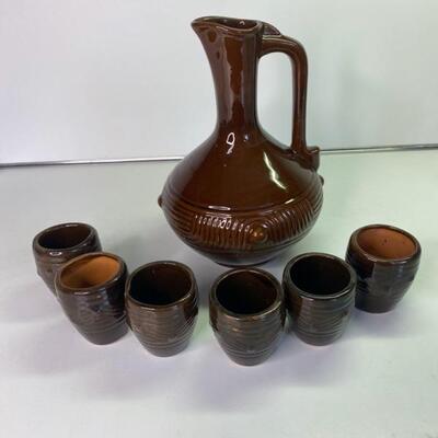 Pottery wine jug and 6 cups