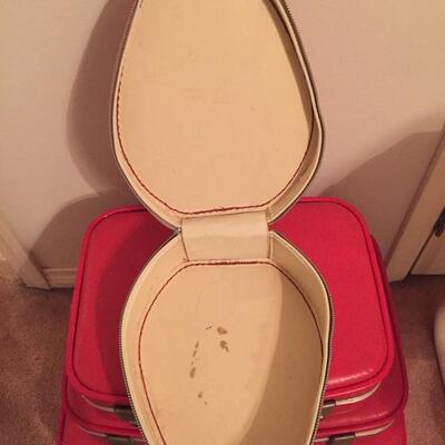 LOT #20. Vintage red four piece suitcase/luggage set.