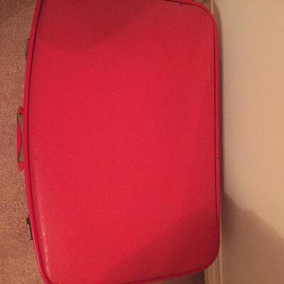 LOT #20. Vintage red four piece suitcase/luggage set.
