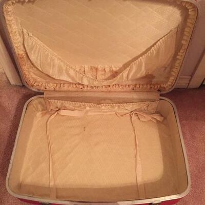 LOT #20. Vintage red four piece suitcase/luggage set.