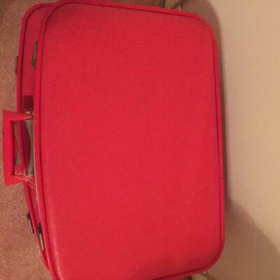 LOT #20. Vintage red four piece suitcase/luggage set.