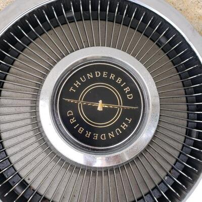 LOT #21. Three vintage Thunderbird hubcaps, + one similar, 60s