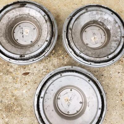 LOT #21. Three vintage Thunderbird hubcaps, + one similar, 60s