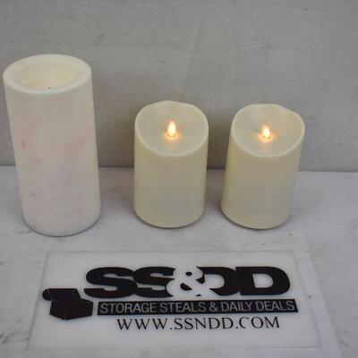 3 pc fake candle, 1 pillar (with some discoloration) and two flickering flame 