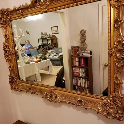 LOT #69. Large gold leaf ornate mirror. 