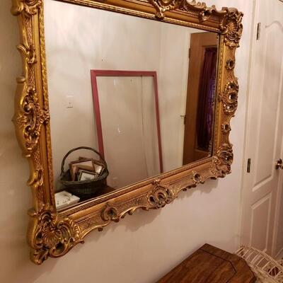 LOT #69. Large gold leaf ornate mirror. 