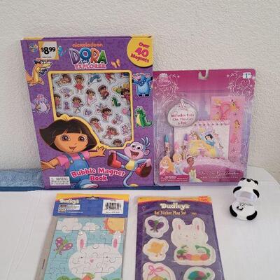Lot 39: New Dora the Explorer Bubble Magnet Book, Disney Princess Activity Set, Window Gels, Puzzle and Panda Bear Necklace 