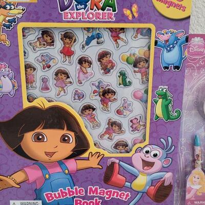 Lot 39: New Dora the Explorer Bubble Magnet Book, Disney Princess Activity Set, Window Gels, Puzzle and Panda Bear Necklace 
