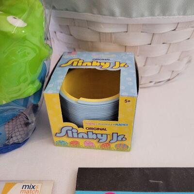 Lot 53: New Easter Basket with Plush Bunny, Mickey Activity Pad, Stickers, Slinky and Bath Toys