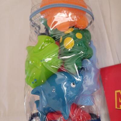 Lot 53: New Easter Basket with Plush Bunny, Mickey Activity Pad, Stickers, Slinky and Bath Toys
