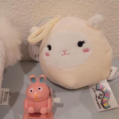 Lot 123: Animated Bunny Basket, Erasers, Stick On Patches, YoYo, (2) Windup Toys and Clip On Soft Plushie 