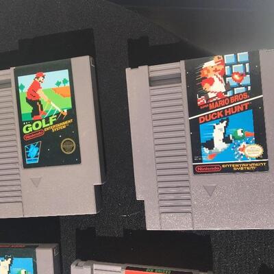 Nintendo original game system NES-001 with 10 games