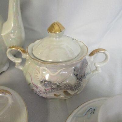 Lot 31 - White Lustreware Dragonware Tea Set
