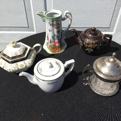 Collection of porcelain and glass with teapots 5 to 8 inches high each