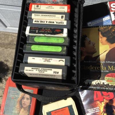 Collection of movie and media with 41 DVDs and 12 eight track tapes
