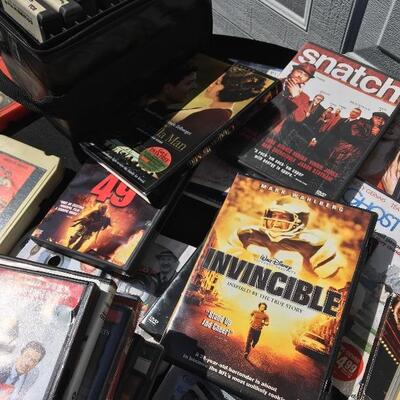 Collection of movie and media with 41 DVDs and 12 eight track tapes