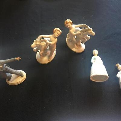 Four piece porcelain figurine collection
