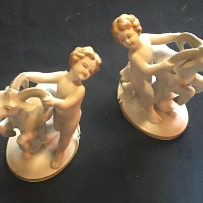 Four piece porcelain figurine collection