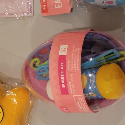 Lot 168: New Duckling Easter Basket with Bubbles, Silly Putty, (2) Grow a Bunnies, Wind up Toy, Puzzle, Goldfish Snack Holder and a...