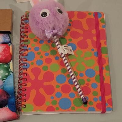 Lot 191: Easter Goodies- Socks, Lip Gloss, Notebook and Pen, Stick On Patches and (2) Small Bunnies 
