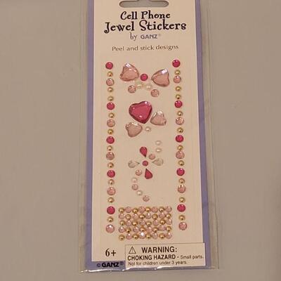 Lot 191: Easter Goodies- Socks, Lip Gloss, Notebook and Pen, Stick On Patches and (2) Small Bunnies 