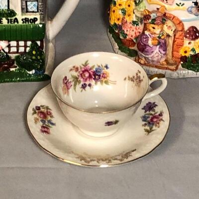 Lot 105 - (2) Whimsical Teapots and a Tea Cup with Saucer