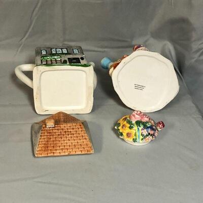 Lot 105 - (2) Whimsical Teapots and a Tea Cup with Saucer