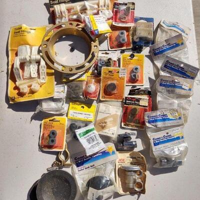 lot 11 - Plumbing parts, brass flange, toilet ball, hinges, joints, washers, valves, etc.