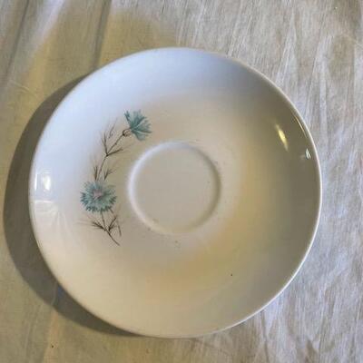White and blue cup and plate set
