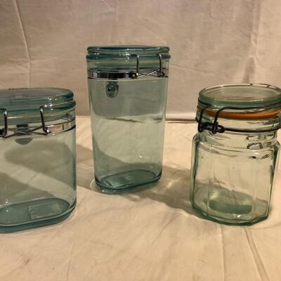 3 green storage containers