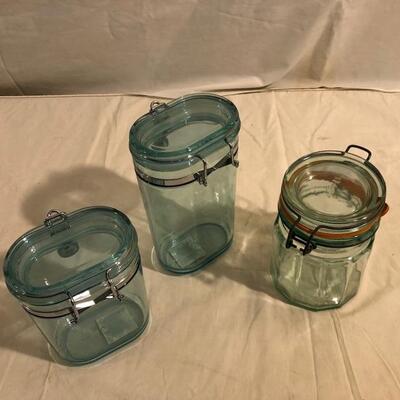 3 green storage containers