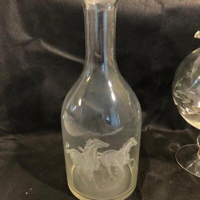 Collection of cut glass vases and one with a bow