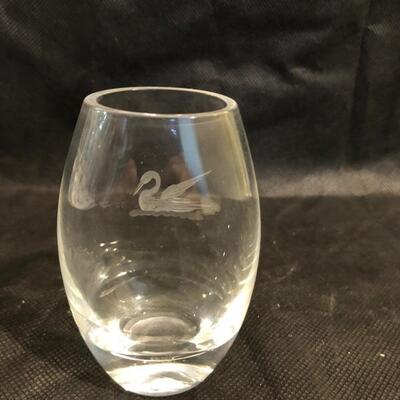 Collection of cut glass vases and one with a bow