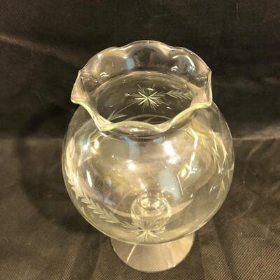 Collection of cut glass vases and one with a bow