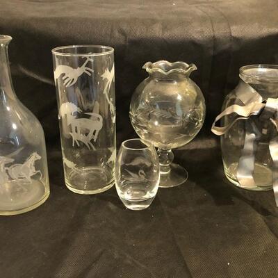 Collection of cut glass vases and one with a bow