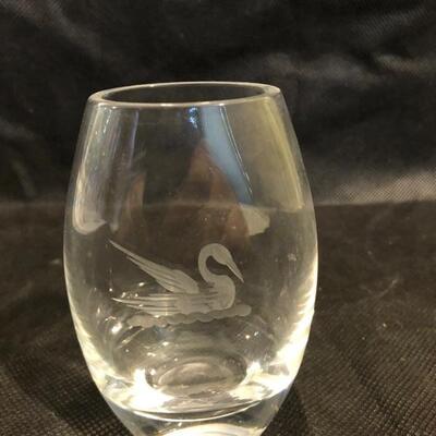 Collection of cut glass vases and one with a bow