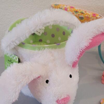 Lot 234: New Flapping Ears and Singing Bunny Basket, Jump Rope, Activity Pad, Bunny Ears Headband, Lip Balm, Wind Up Toys and Ty Beanie...