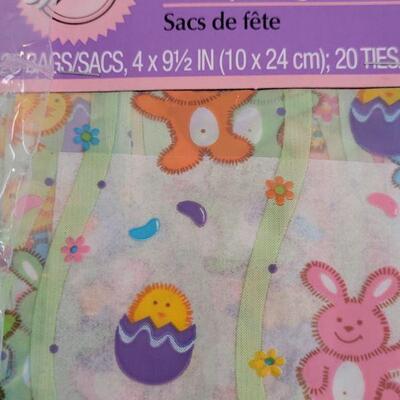 Lot 242: New Disposable Plates and Napkins, Treat Bags, Edible Grass, Window Easter Gels