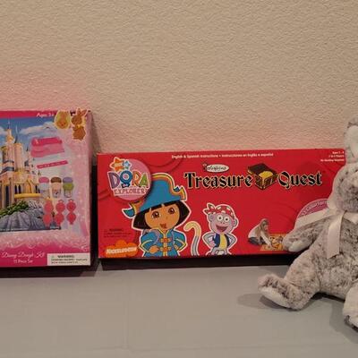 Lot 284: New Dora the Explorer Game, Disney Dough Kit and Douglas Bunny