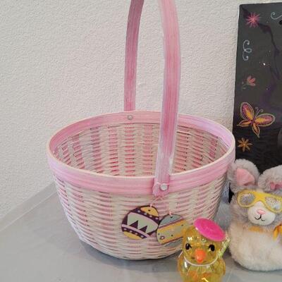 Lot 316: New Easter Basket filled with Lip Balm, Zip a long, Stickers, Chalkboard Placemat Pez, Sculpt n Soap, Goo Egg, Squishmallow and...