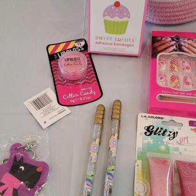 Lot 317: Hallmark Jelly Roll Rug Easter Basket and Makeup, Keychain, Gel Pens, Bandaid, Mirth Mermaid Slap Bracelet, 