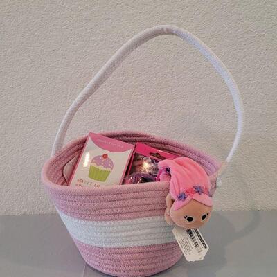 Lot 317: Hallmark Jelly Roll Rug Easter Basket and Makeup, Keychain, Gel Pens, Bandaid, Mirth Mermaid Slap Bracelet, 