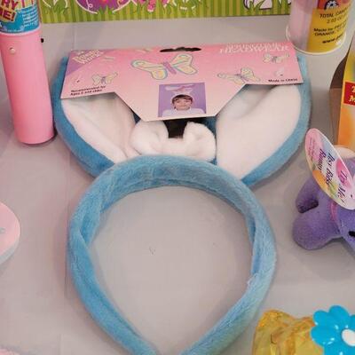 Lot 322: New Easter Basket including Chick Palm Pet,Ty Beanie Bunny, Hallmark Mirth Mermaid Slap Bracelet, Light Up Wand, Pez, Bunny Ears...