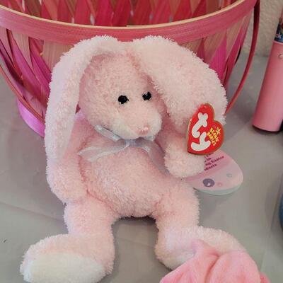 Lot 322: New Easter Basket including Chick Palm Pet,Ty Beanie Bunny, Hallmark Mirth Mermaid Slap Bracelet, Light Up Wand, Pez, Bunny Ears...