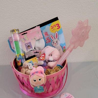 Lot 322: New Easter Basket including Chick Palm Pet,Ty Beanie Bunny, Hallmark Mirth Mermaid Slap Bracelet, Light Up Wand, Pez, Bunny Ears...