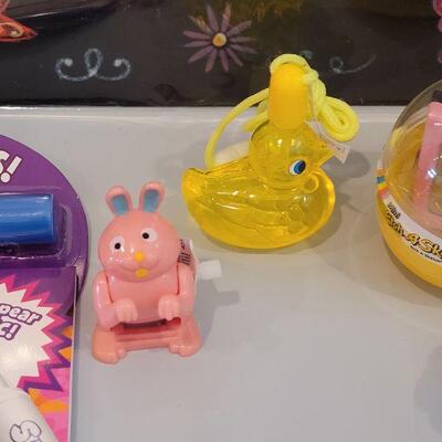 Lot 370: New Peeps Easter Bucket, Chalkboard Placemat, Activity Pad, YoYo, Sculpt n Soap, Bubbles, Flutterfly Snoopy and Hallmark Knit Bunny