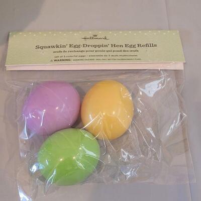 Lot 374: Hallmark Egg Dropping Hen with Extra Eggs