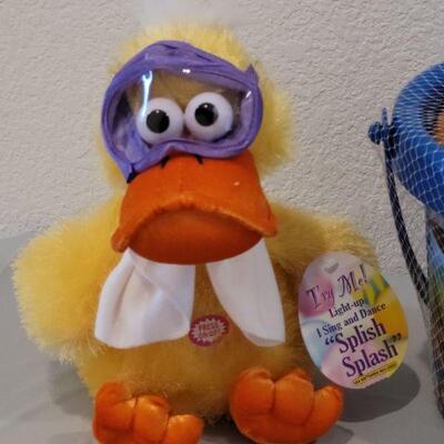 Lot 384: New Large Alphabet Magnets, Toy Story Sand & Sea Set and Animated Duck