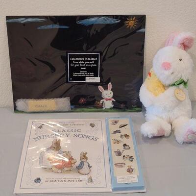 Lot 385: New Peter Rabbit Nursery Songs Book, Chalkboard Placemat and Hallmark Animated Bunny 